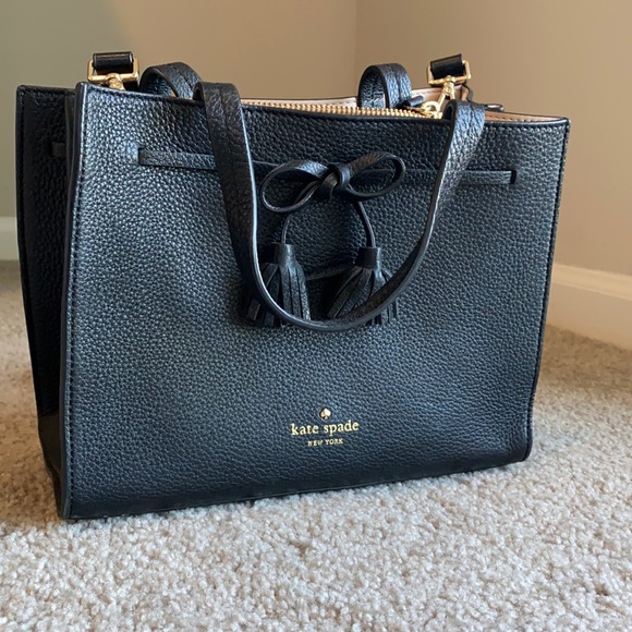 Kate Spade Black satchel with a bow. Mid-size and barely used